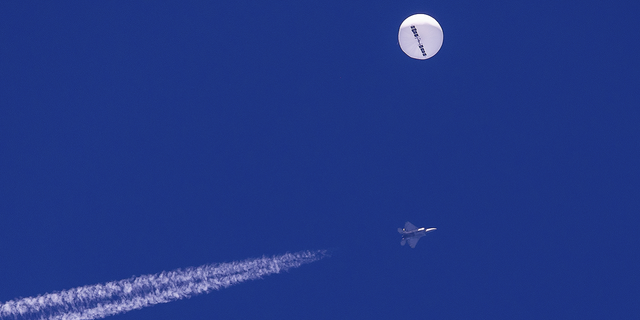 A Chinese spy balloon drifts above the Atlantic Ocean minutes before it was shot down, just off the coast of South Carolina on Feb. 4.